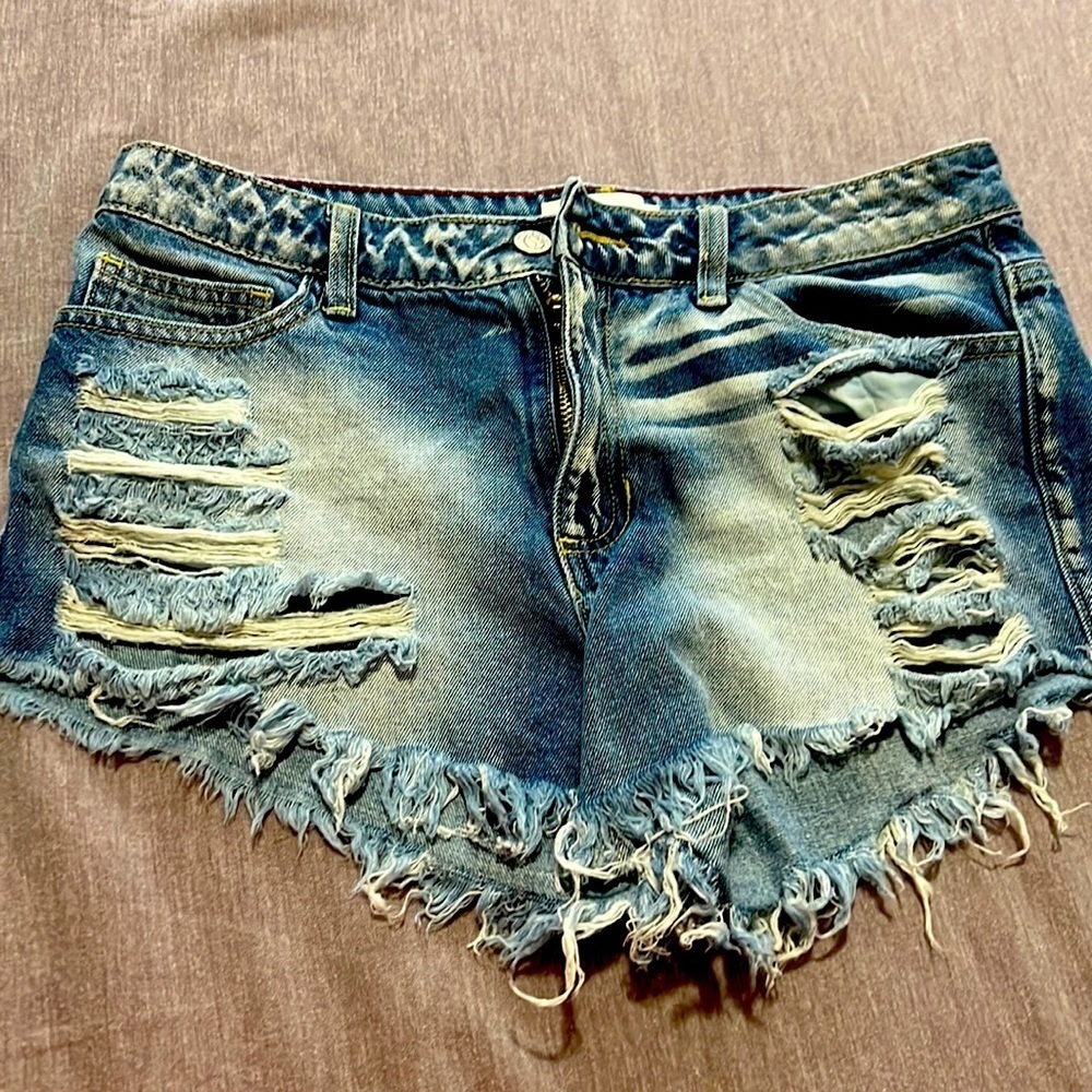 Denim ripped shorts.